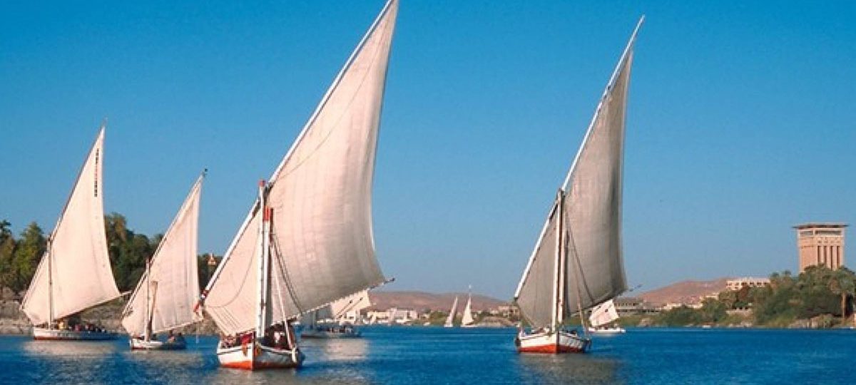 Aswan, Egypt, Nile River, ancient monuments, Nubian culture, desert safaris, Kom Ombo Temple, Philae Temple, Abu Simbel, felucca sail, Nile cruise, botanical gardens.